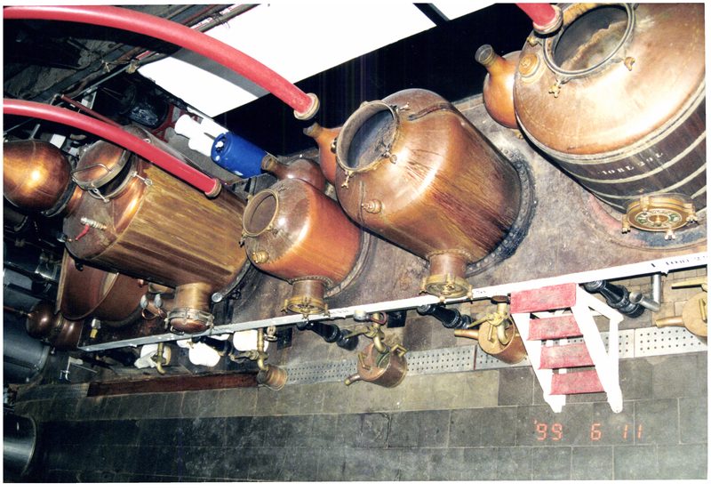 Copper pot stills inside the De Beukelaer distillery in Antwerp, used to produce Elixir d'Anvers